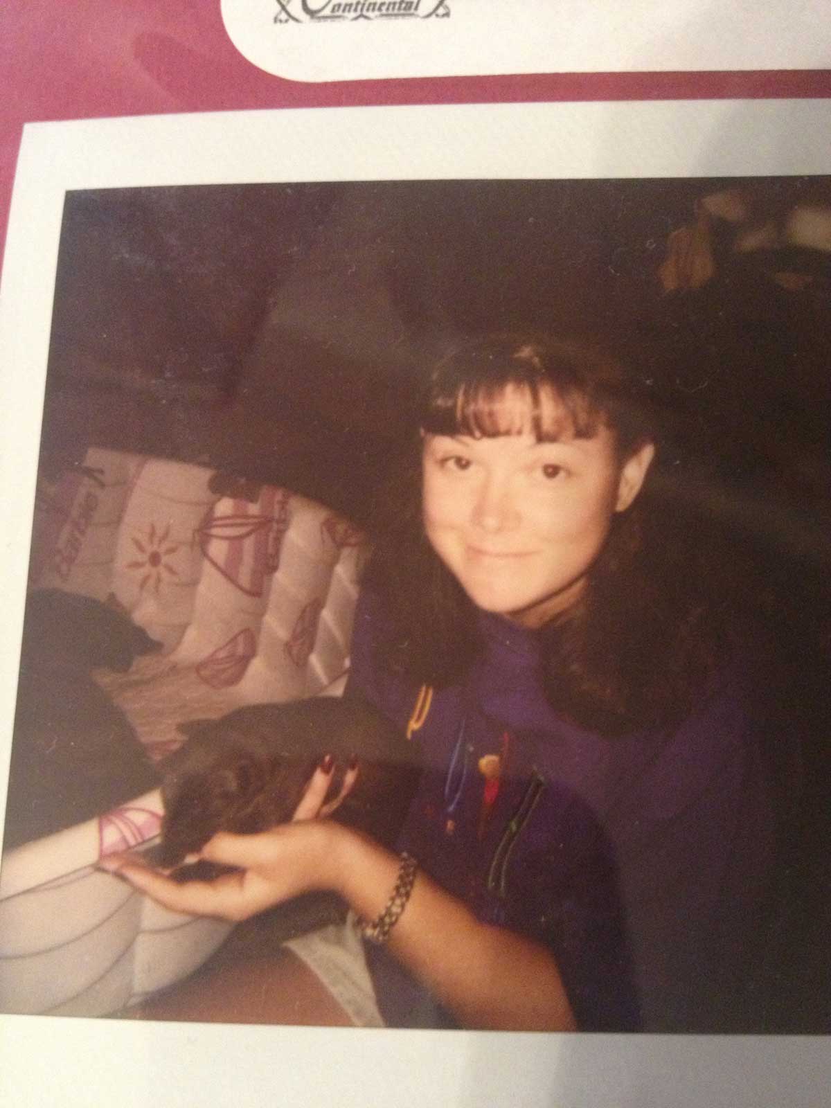 picture of a picture of lady holding a puppy